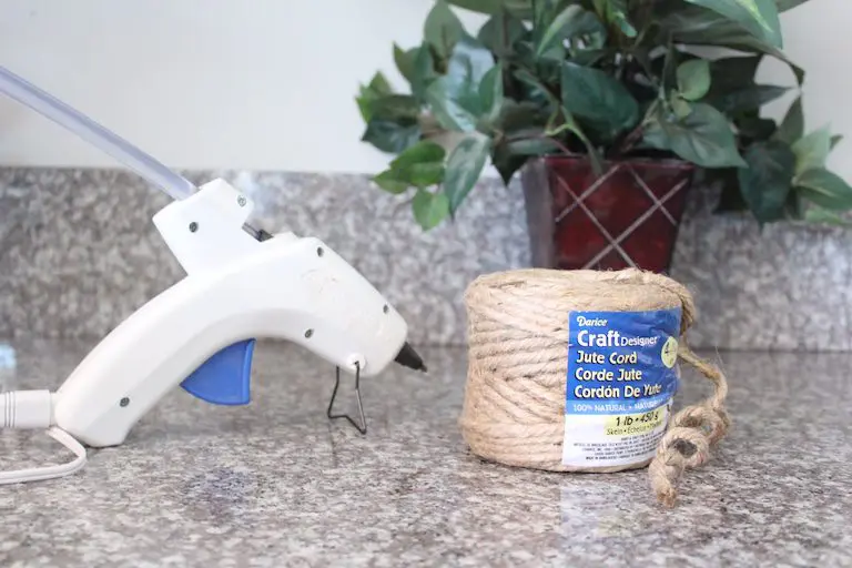 hot glue gun next to jute cord