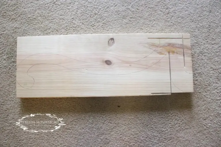 Piece of wood with a drawing on it in pencil