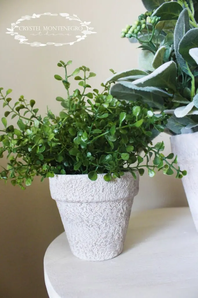 Fake plant on a terra cotta pot