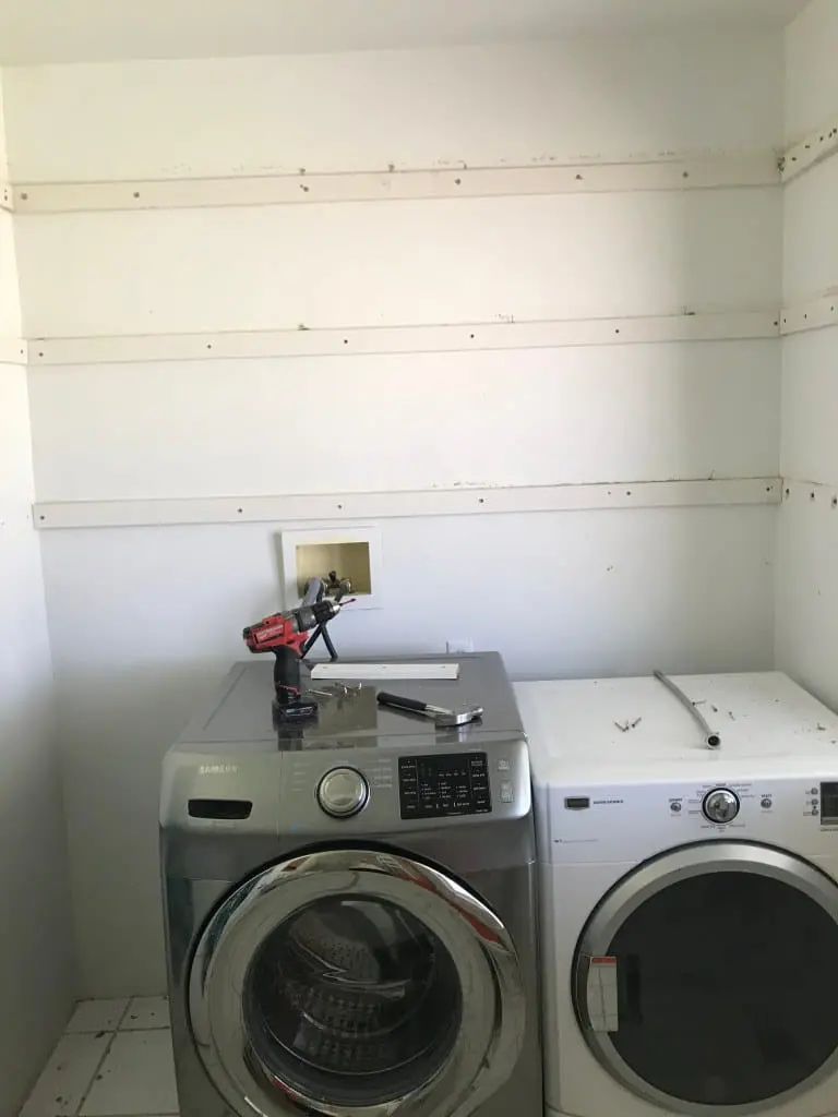 Laundry room wall for shelves