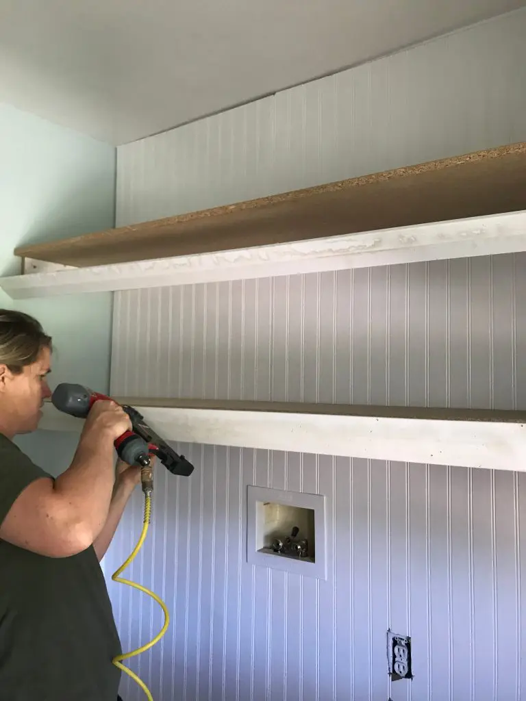 Nail gun in a laundry room for shelves