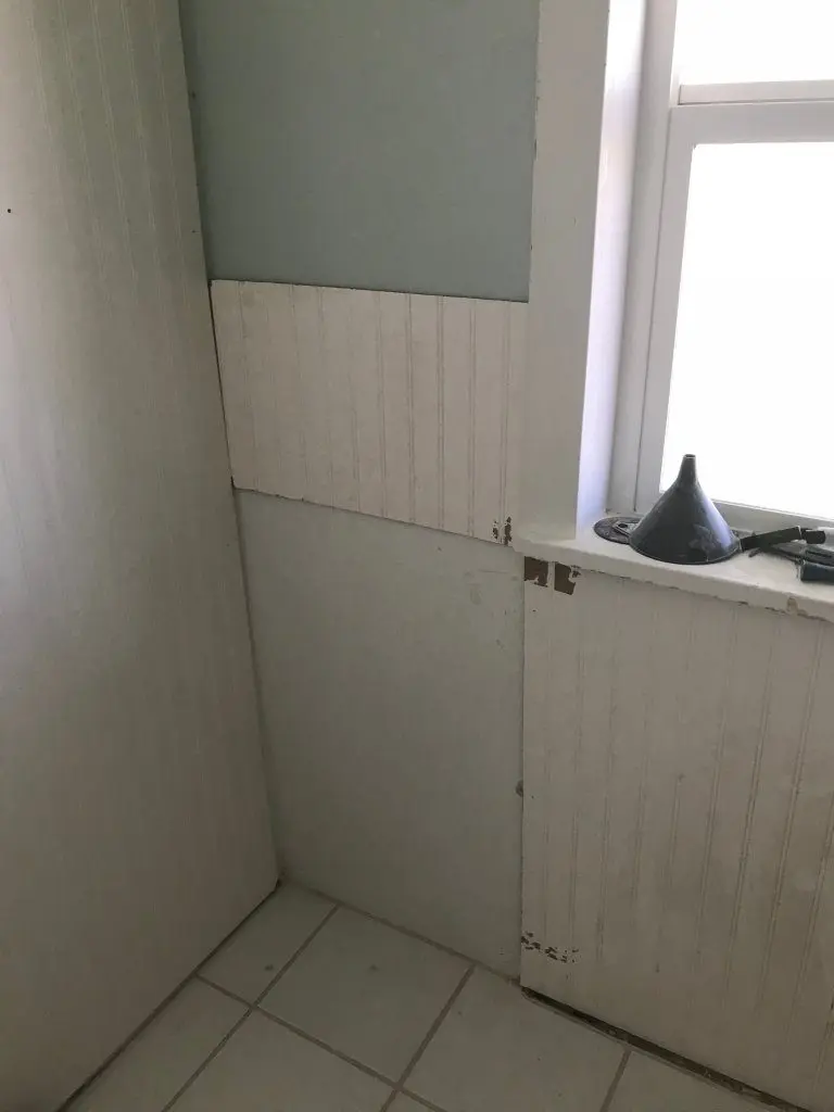 Beadboard in a bathroom around a window