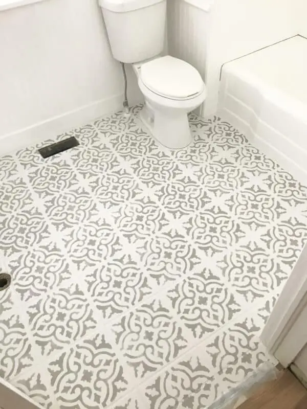 beautiful grey stencil on white tile floor