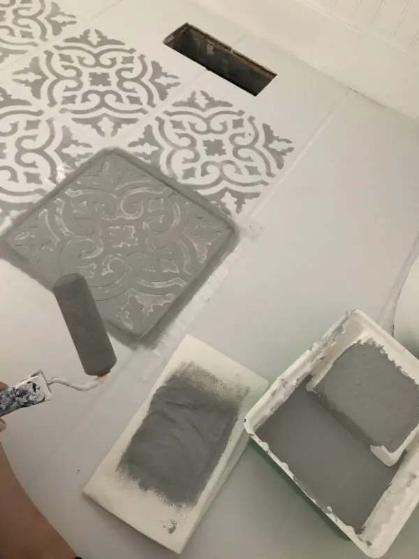 grey stencil over white paint