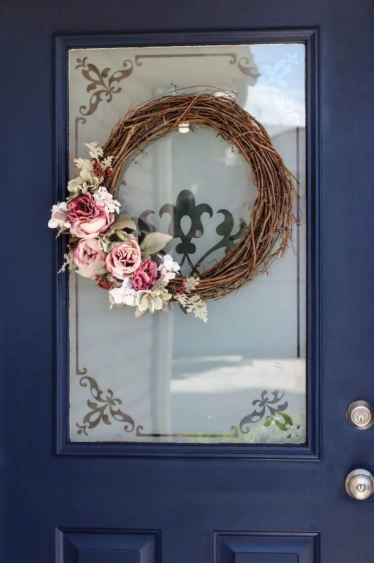 exterior door painted blue with wreath