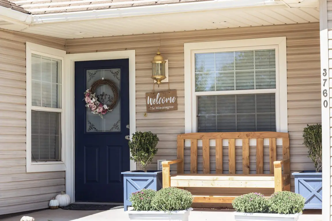 exterior door painted blue with wreath