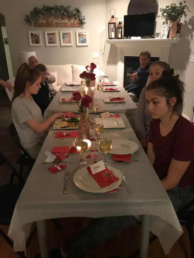 6 people sitting at a table 