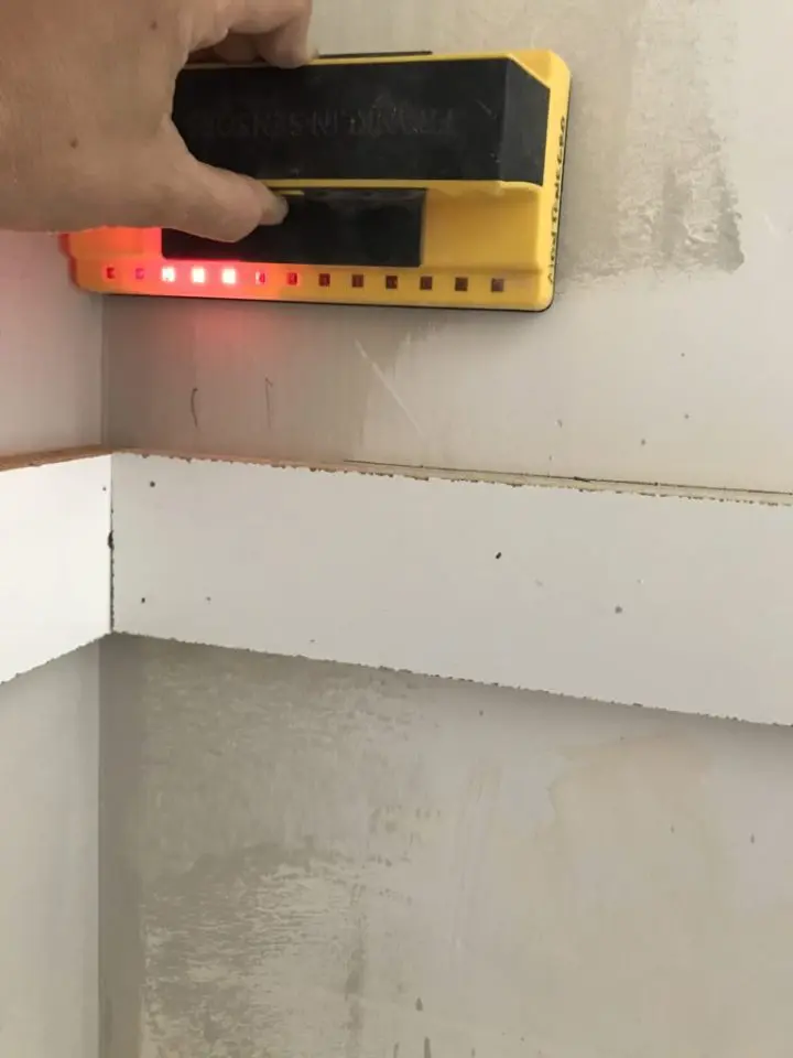 Stud finder on wall