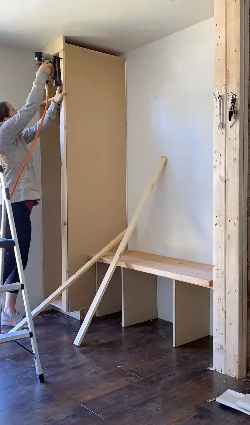 woman using nailgun on mdf