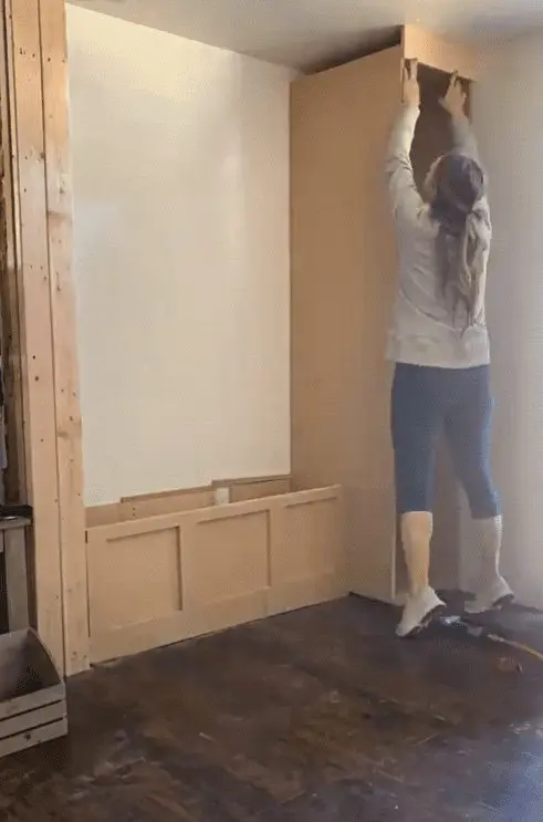 Woman putting crown on a built in