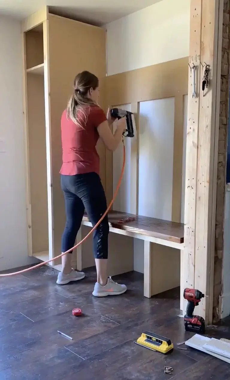 woman using nailgun in mdf