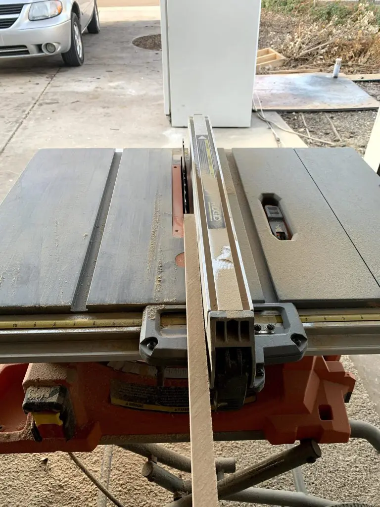 miter saw cutting wainscoting