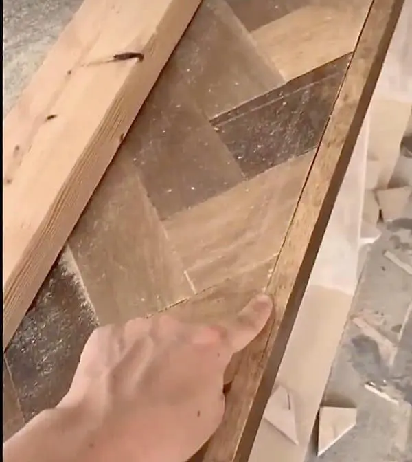 finger pointing to crack in countertop