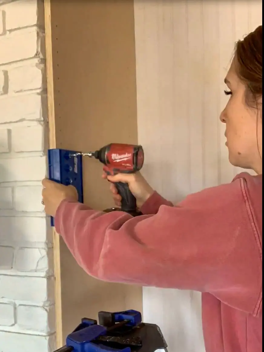 DIY built-in office cabinets with adjustable shelving installed, providing customizable storage for an organized home workspace.
