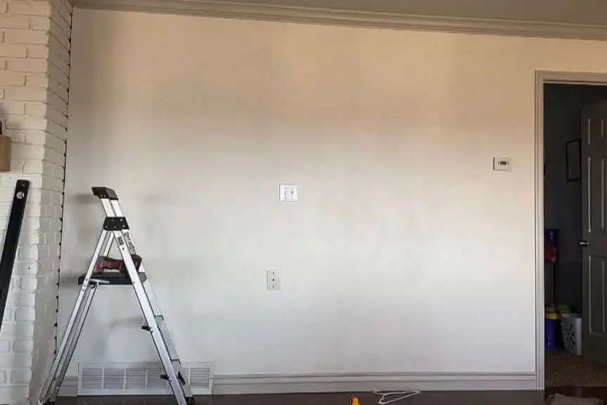 Blank wall prepped for creating a custom-built home office workspace.