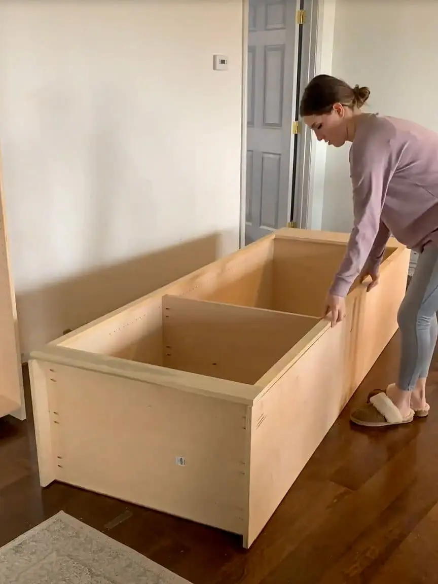 Framing a DIY built-in office cabinet with select pine for a seamless and polished home office storage solution.