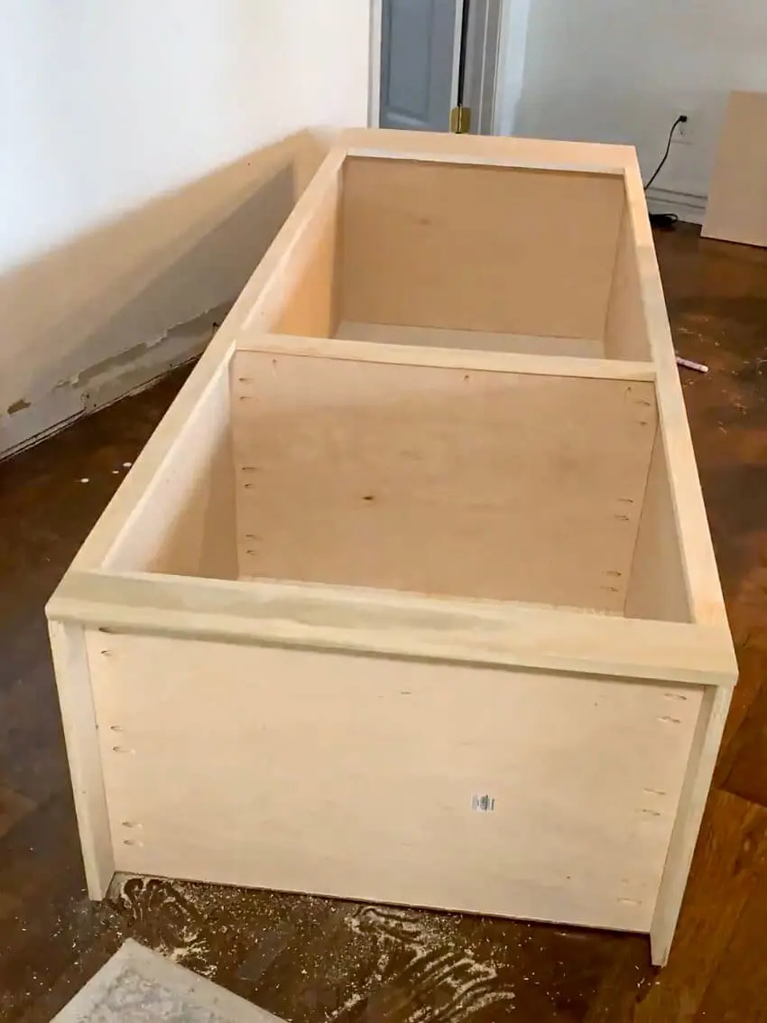 Step-by-step progress of building DIY office cabinets, showcasing the assembled cabinet boxes and custom built-in storage for a home office.