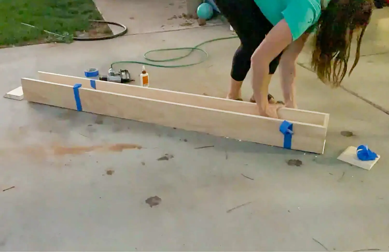 Three pine boards with mitered edges laid flat ready for miter fold assembly