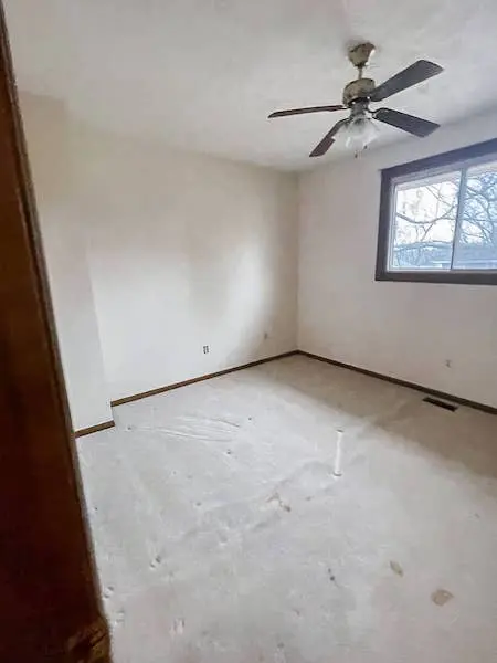 old bedroom with dirty carpet