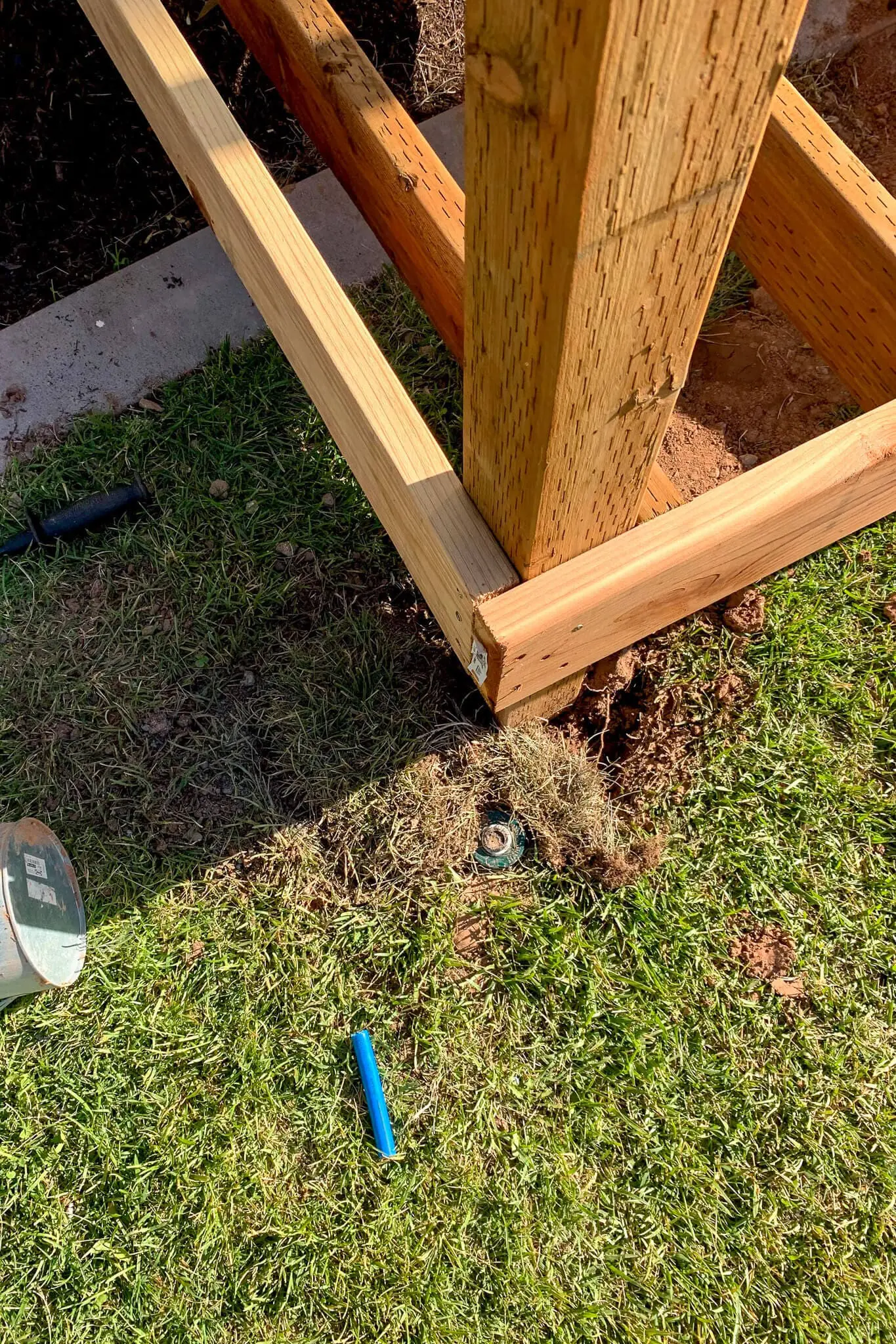 Close-up of rim joists meeting at the corner of a 4x4 porch post during DIY porch construction