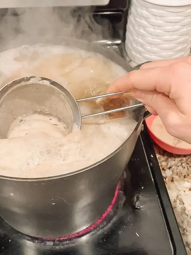 skimming foam off bone broth