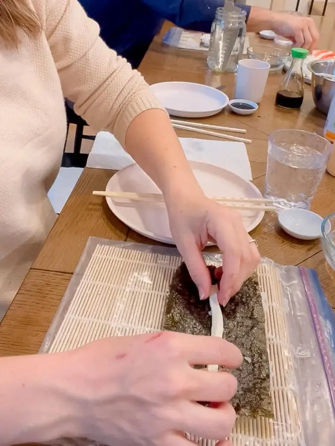 cream cheese on sea weed for sushi roll