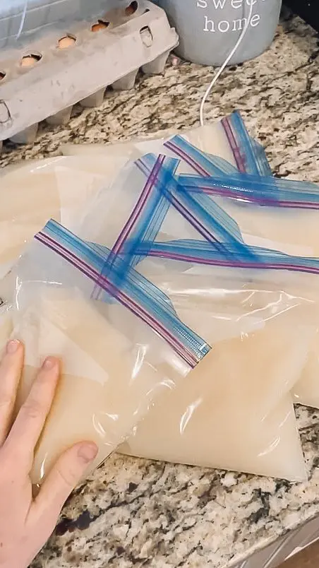 woman measuring bone broth