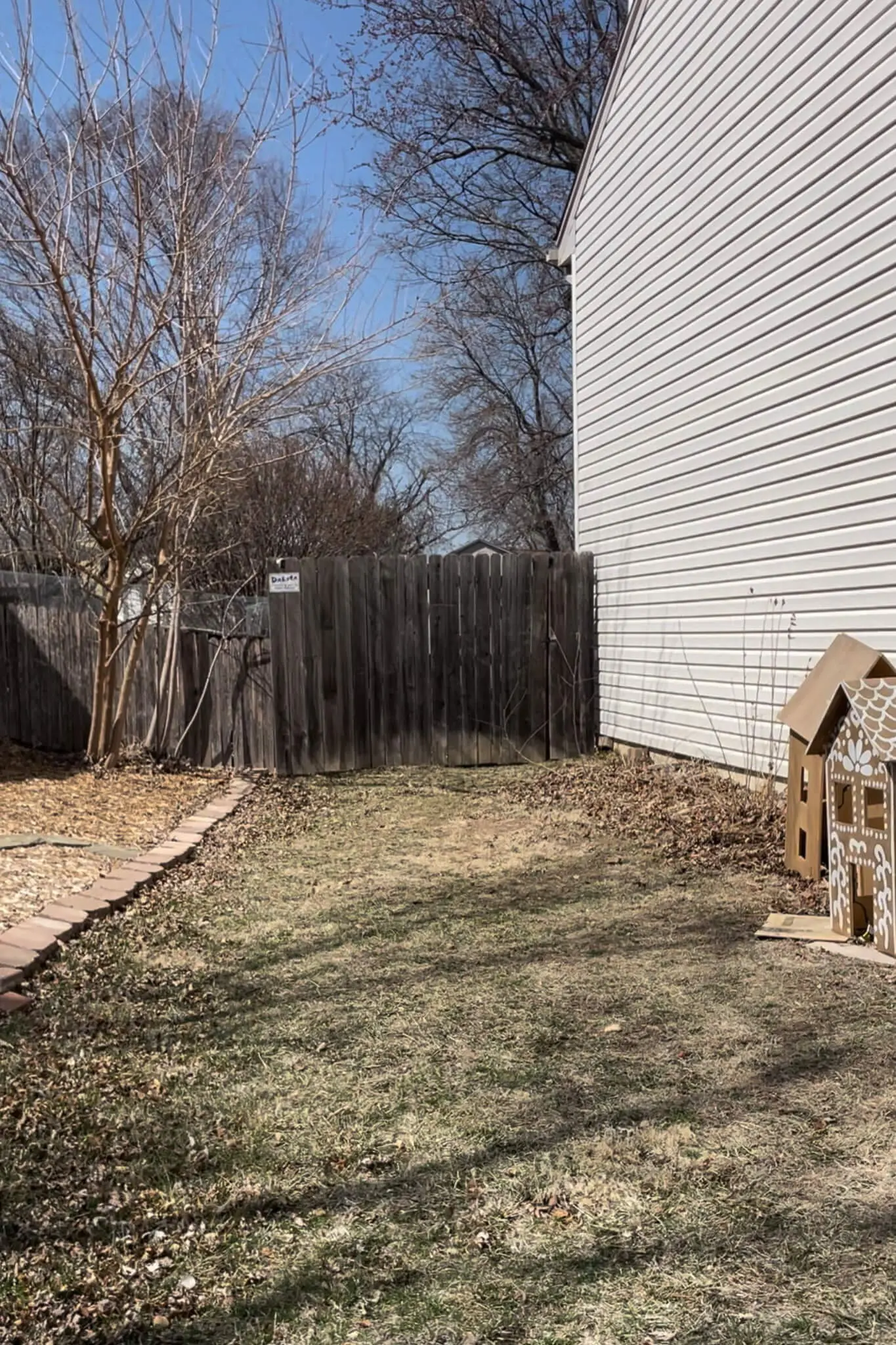 Side yard next to house prepped and leveled for installing raised garden beds