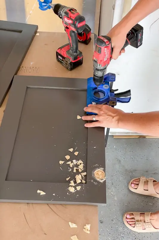woman building shaker cabinet doors