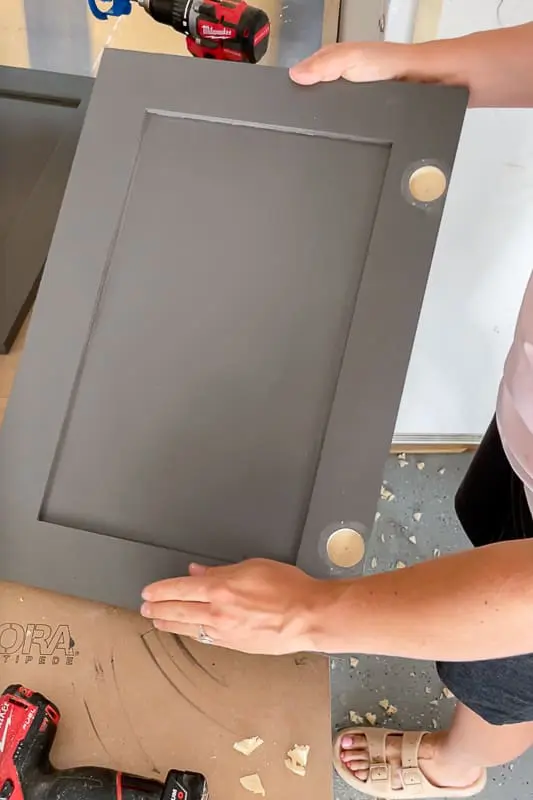 woman building shaker cabinet doors