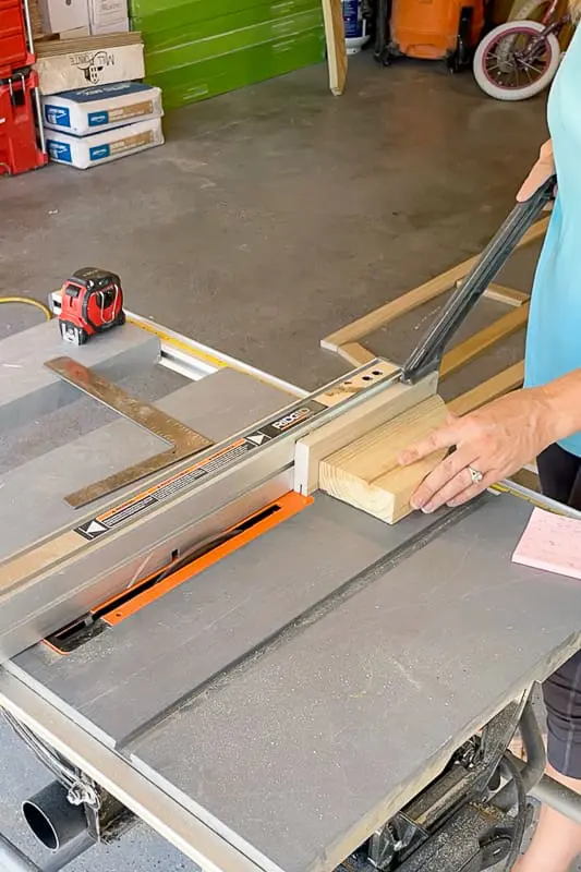 using a push stick to cut wood