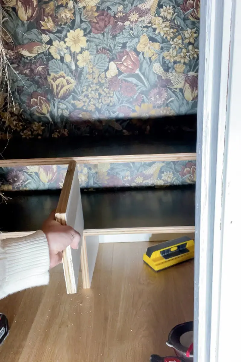 Adding custom shoe shelf supports in coat closet makeover