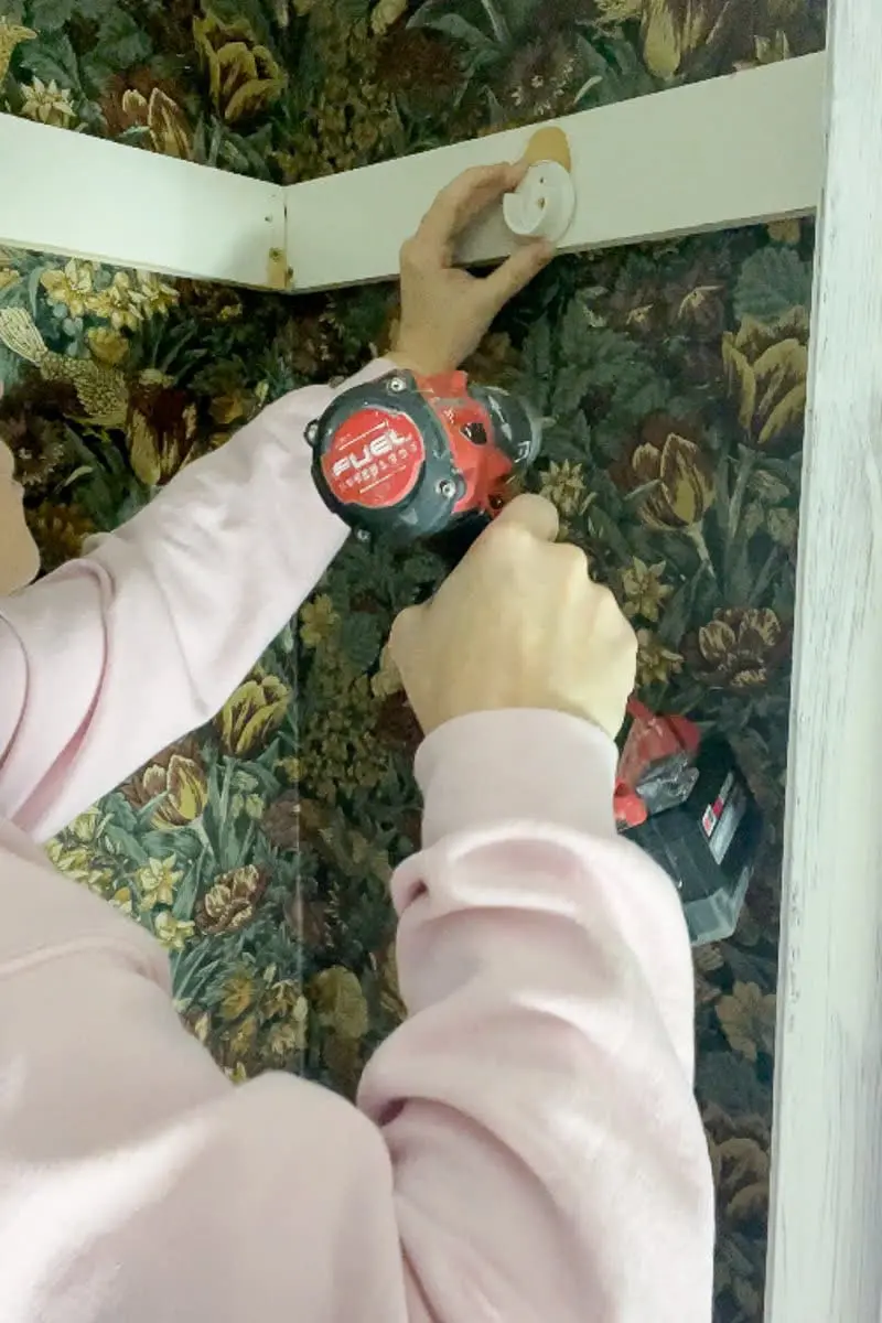 Installing coat closet hanging rod brackets