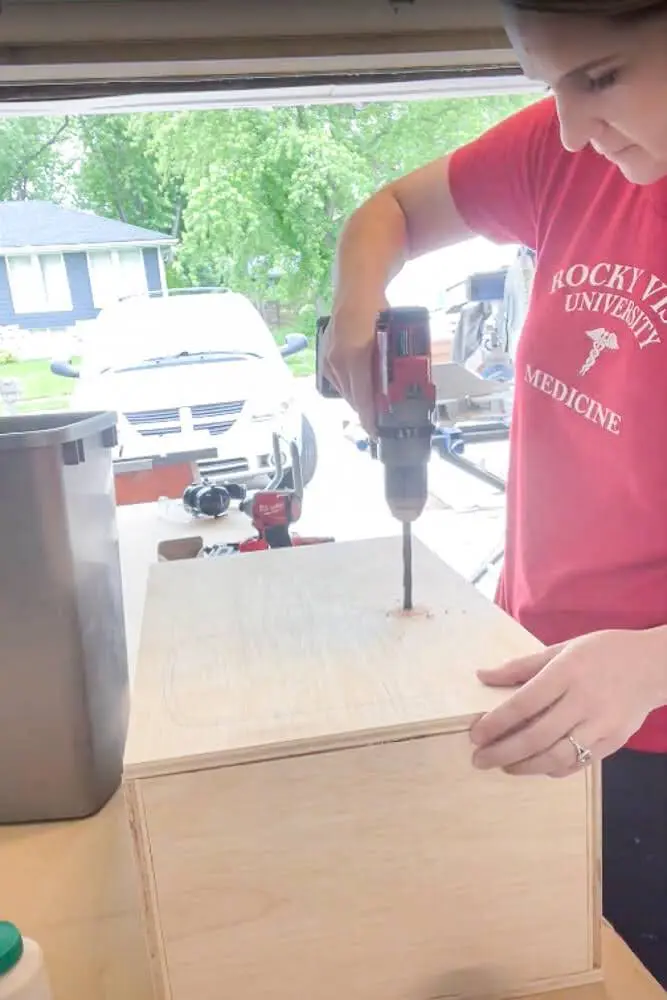 Drilling hole in wood to prep for using a jigsaw to cut