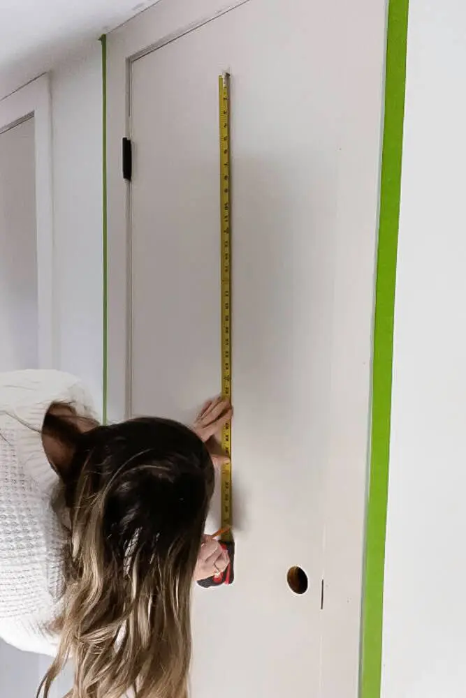 Measuring down center of closet door for frame