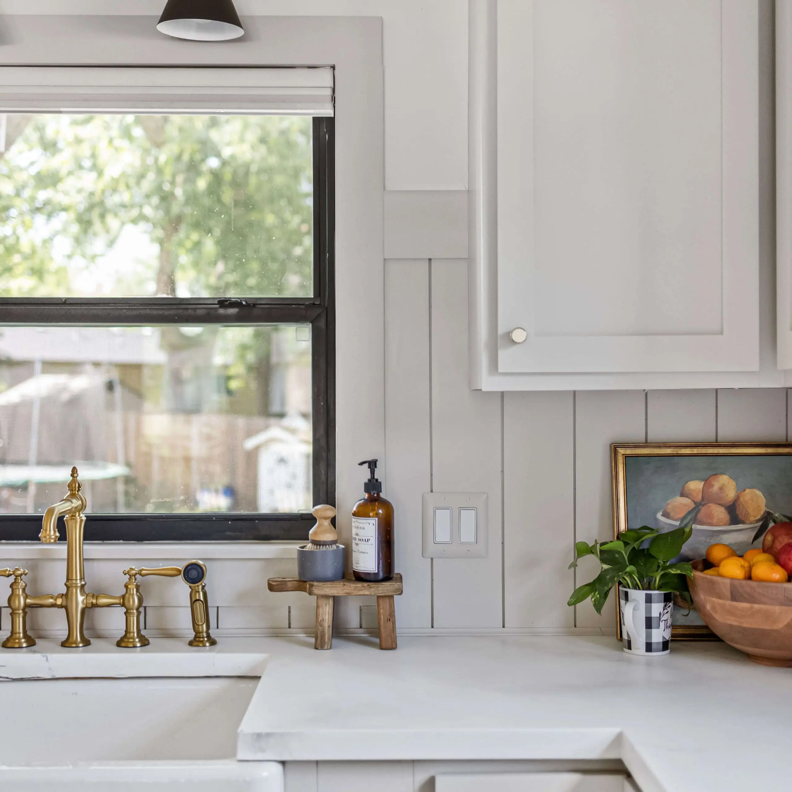 Beautiful shiplap backsplash with farmhouse sink.
