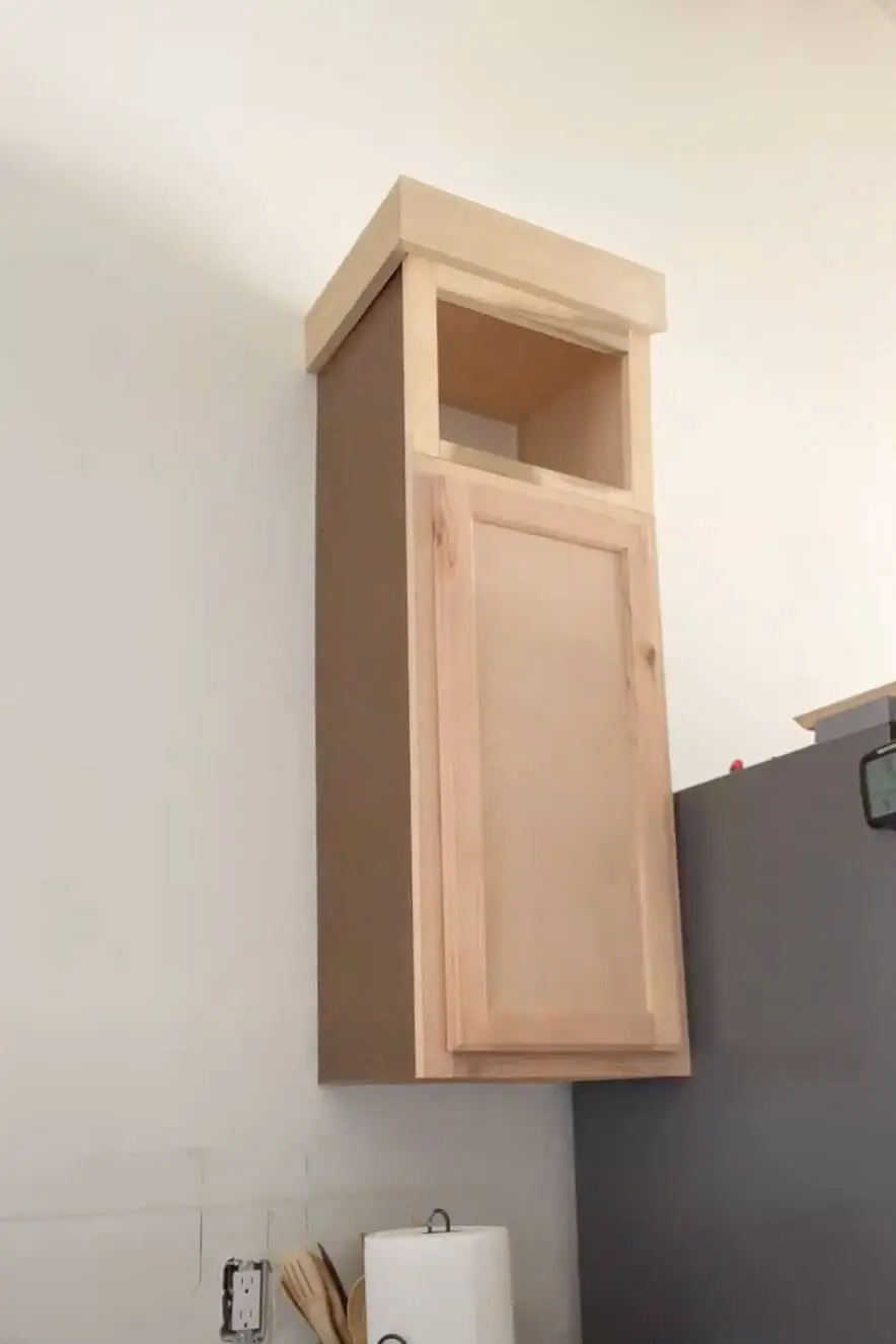 Extending kitchen cabinets to the ceiling.