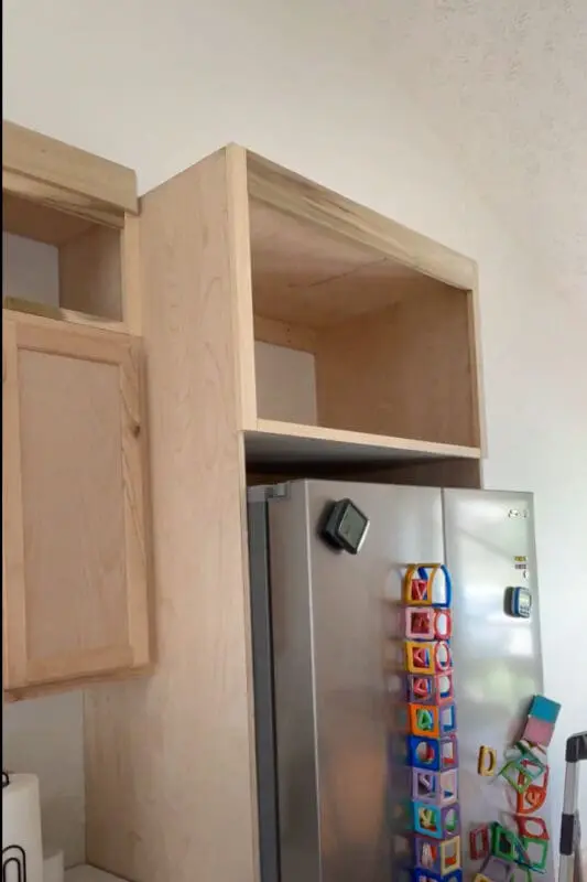 Trim added to DIY Refrigerator Cabinet.