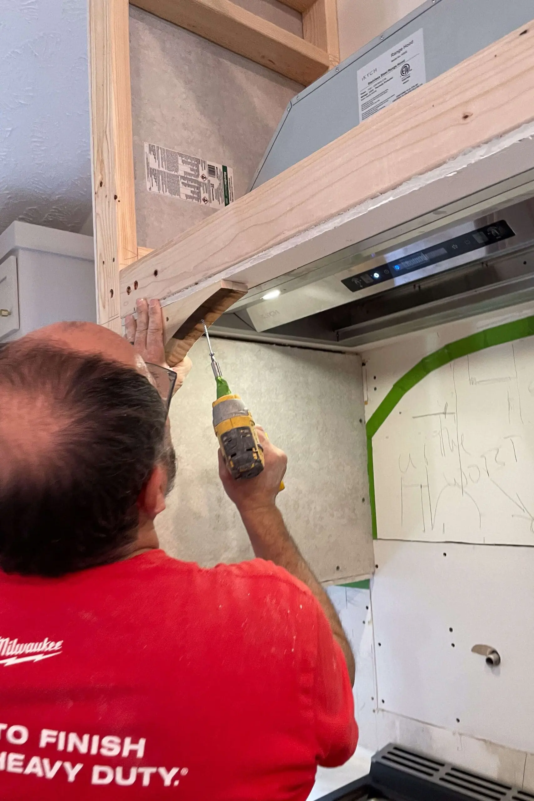 Adding an arch to a DIY range hood. 