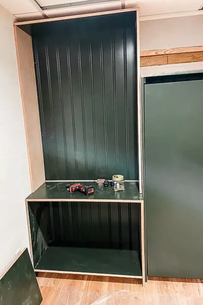 green built-ins with shiplap