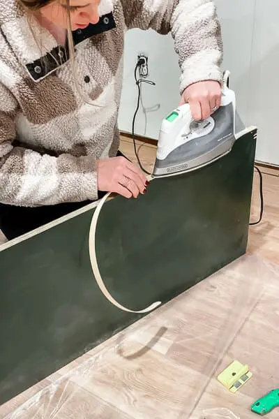 woman ironing on edge banding