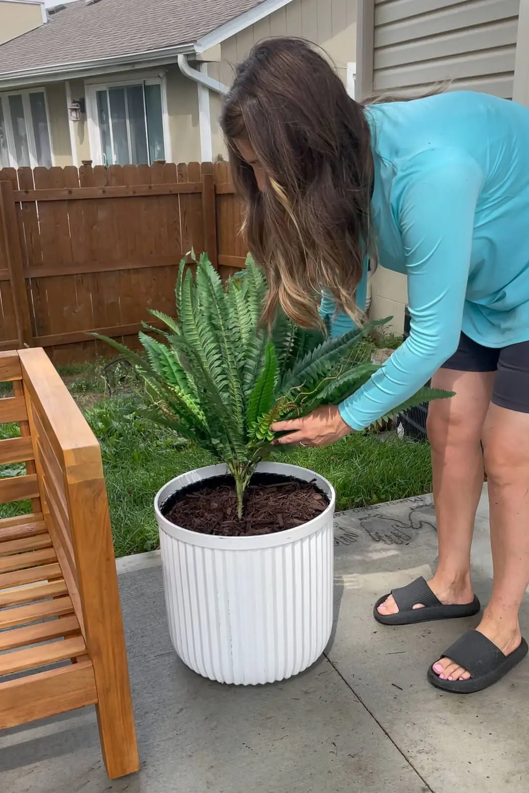 Adding faux greenery to the outdoors.
