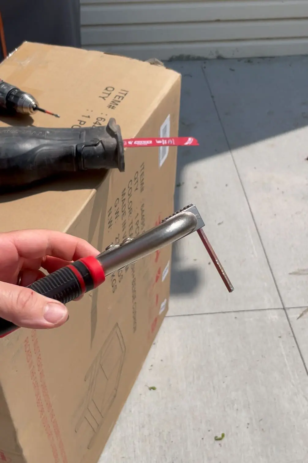 Cutting off an Allen Wrench for faster furniture assembly.