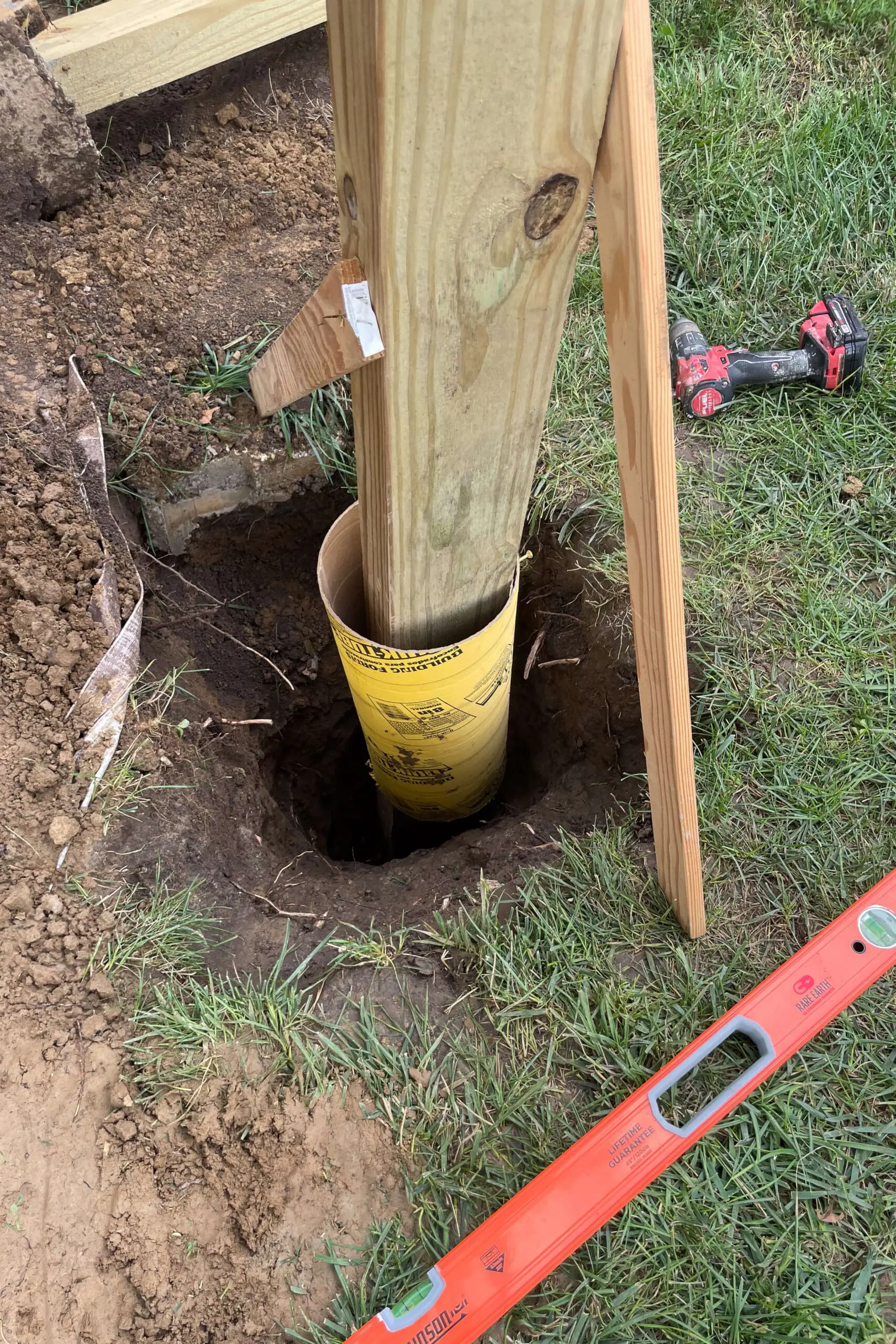 Using a concrete form tube before pouring concrete. 