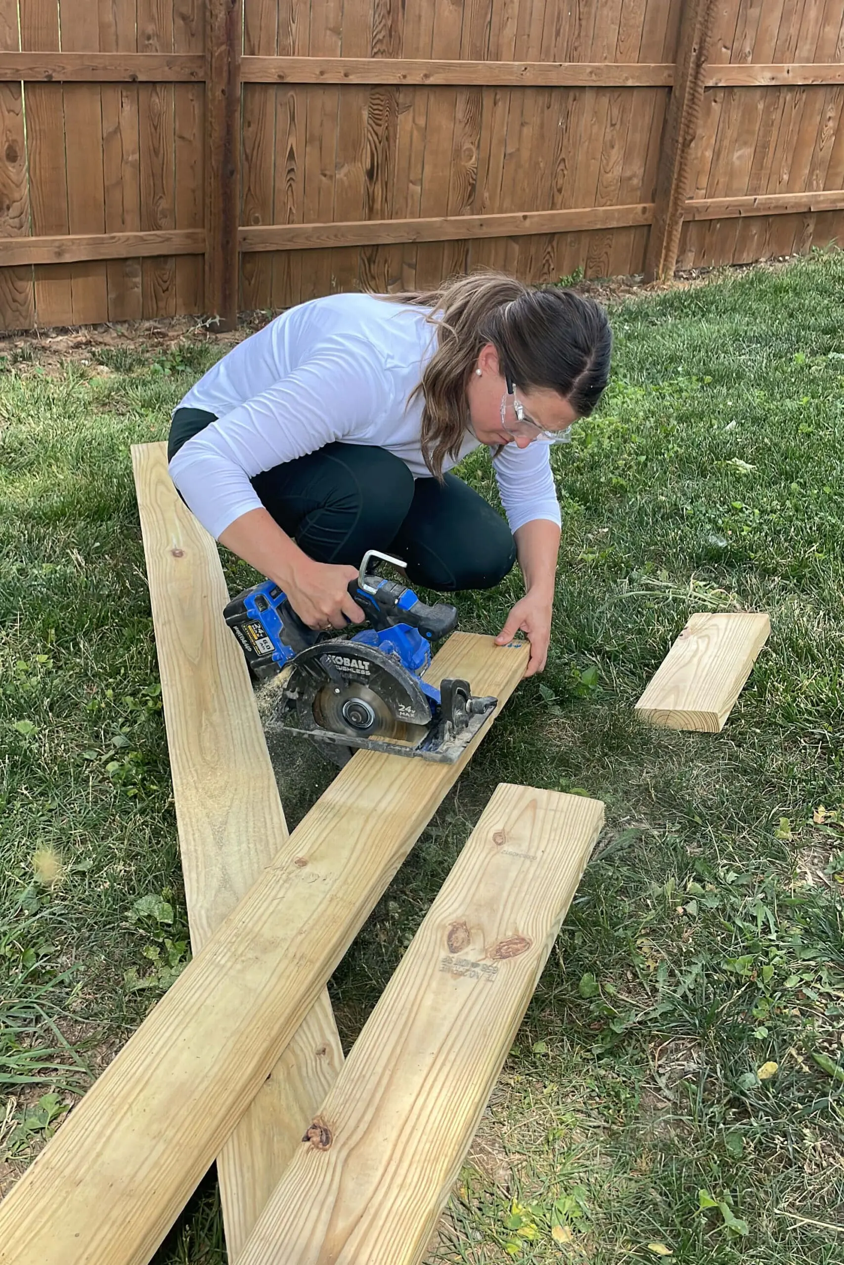 Using a circular saw to cut wood for building a hammock stand.