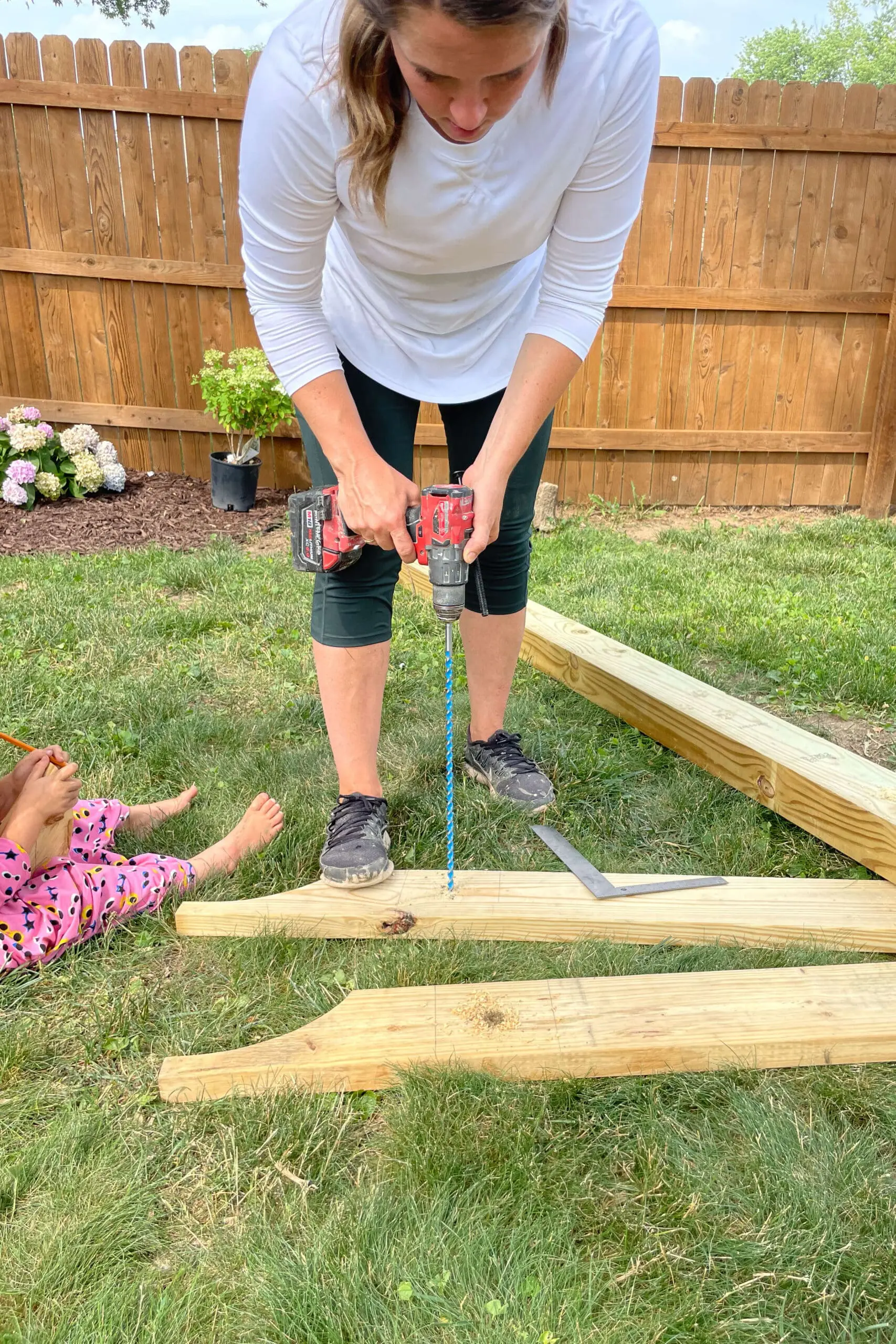 Drilling holes for carriage bolts.