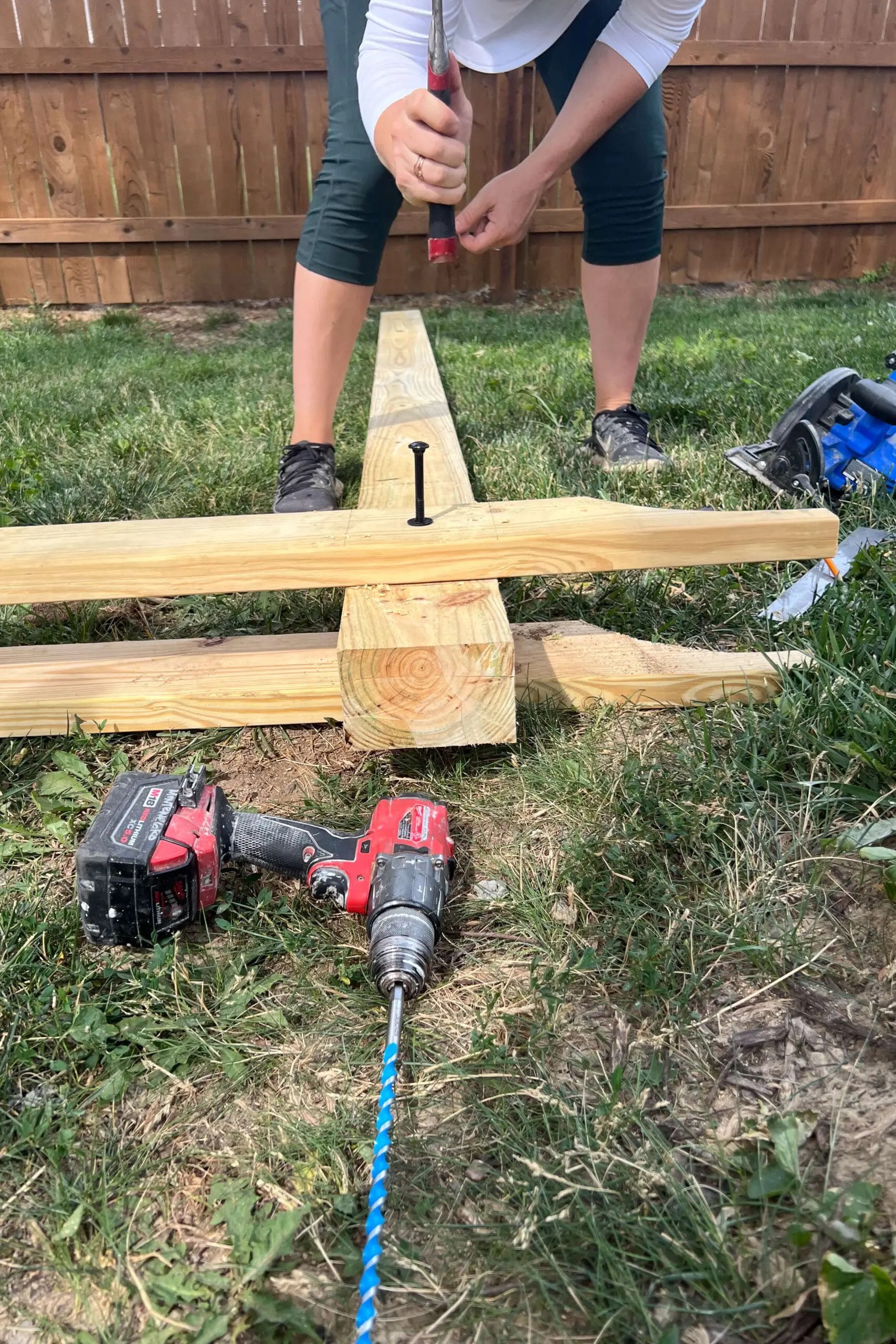 Using carriage bolts to hold together a hammock stand.
