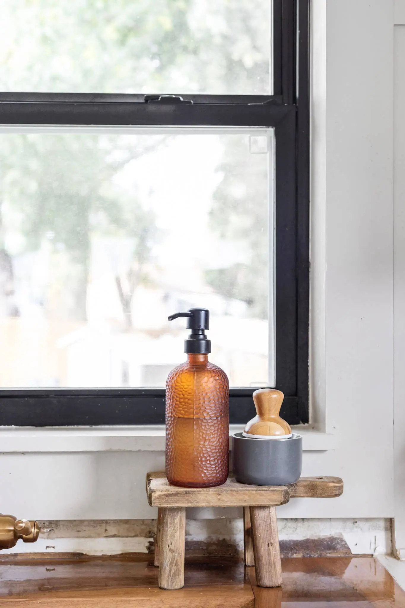 Windows painted black in a gorgeous, fully renovated kitchen.