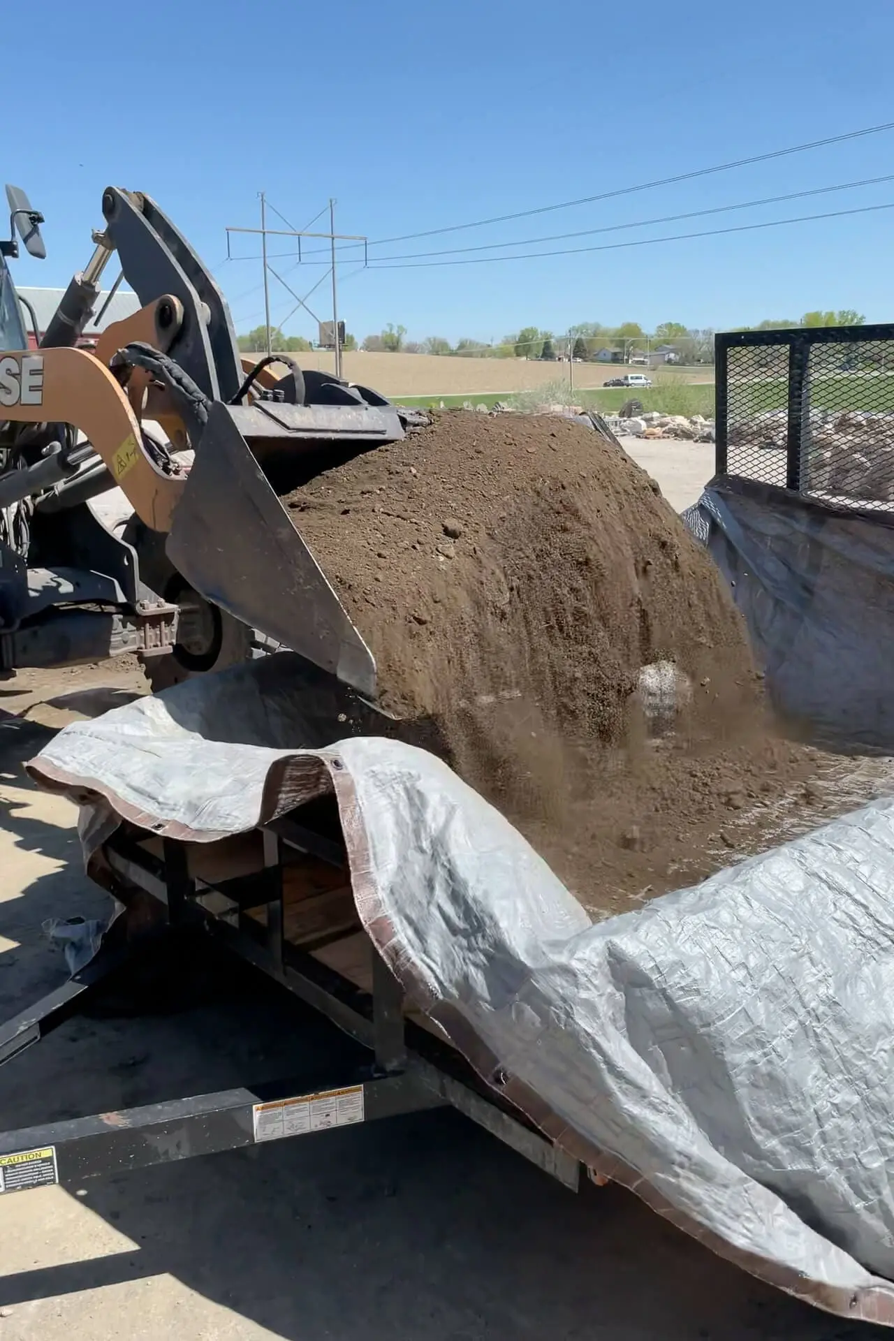 Getting a big load of dirt to make a flower bed.