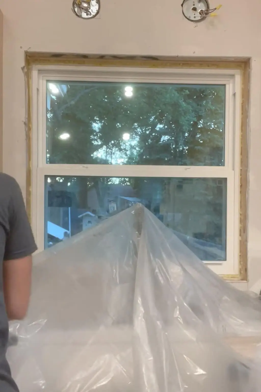 Using plastic to cover items that you do not want spray paint to get on.